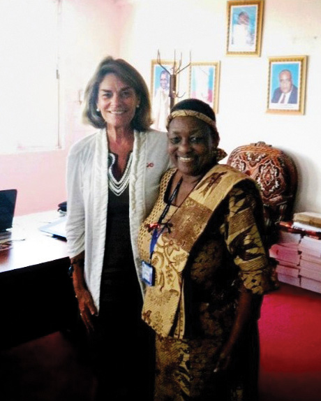 Global Impact: Nurse Pat Daoust conducting frontline HIV clinical education in Uganda—taking the lessons of low-barrier care and health equity forged at the Boston Living Center to healthcare workers across East Africa.