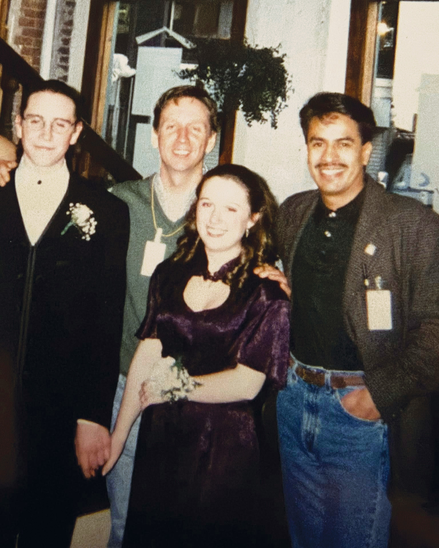 A Night to Remember: BLC Volunteer Director Jim Greene and front desk supervisor Alfredo Hernandez pause for a photo with high school volunteer Nicole Pascarelli (O’Brien) and her prom date—now husband—Chris. Community members and staff stayed late at the office just to celebrate Nicole's prom night.